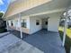 Charming home exterior showcasing a carport, neutral tones, and an inviting entrance at 540 Florida S Cir, Apollo Beach, FL 33572