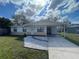 Charming single-story home with a carport, white rock landscaping, and a well-maintained lawn at 540 Florida S Cir, Apollo Beach, FL 33572