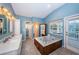 Bathroom featuring double sinks, a soaking tub, and lots of space at 614 Maryland Ave, Crystal Beach, FL 34681