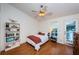 Cozy bedroom with bed, adjacent to a deck and lots of natural light at 614 Maryland Ave, Crystal Beach, FL 34681