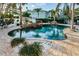 An in-ground pool includes a spa and a surrounding brick patio at 614 Maryland Ave, Crystal Beach, FL 34681