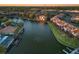 Aerial view of homes along a winding canal at sunset at 6328 Newtown Cir # 28A1, Tampa, FL 33615