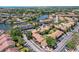 Aerial view of a condo community and waterways with mature trees and landscaping at 6328 Newtown Cir # 28A1, Tampa, FL 33615