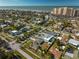 Aerial view of community, showcasing mature trees and proximity to the ocean at 66 Kipling Plz, Clearwater Beach, FL 33767