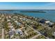 Gorgeous aerial view of waterfront community featuring lush landscaping and stunning water views at 66 Kipling Plz, Clearwater Beach, FL 33767