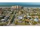 Scenic aerial shot of a community near the beach, featuring well-kept houses and palm-lined streets at 66 Kipling Plz, Clearwater Beach, FL 33767