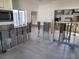 Kitchen area under renovation, featuring stone tile floors and unfinished walls, ready for customization at 66 Kipling Plz, Clearwater Beach, FL 33767