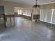 Bare living room showcasing stone tile floors and unfinished walls, ideal for custom design at 66 Kipling Plz, Clearwater Beach, FL 33767