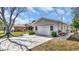 A detached single-car garage with a concrete driveway and tidy landscaping on a sunny day at 7048 68Th N St, Pinellas Park, FL 33781