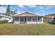 Cozy sunroom provides an enjoyable view of the home's well-maintained backyard, offering a blend of indoor comfort and outdoor views at 7048 68Th N St, Pinellas Park, FL 33781