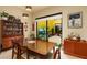 Inviting dining room adjacent with courtyard views and a vintage display cabinet at 707 Highland N St, St Petersburg, FL 33701