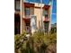 Exterior view of property showing front door, manicured landscaping and palm trees at 707 Highland N St, St Petersburg, FL 33701