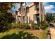 Exterior showcases lush landscaping, lawn, and seating area for outdoor living at 707 Highland N St, St Petersburg, FL 33701