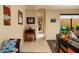 Bright hallway with tiled floors, accent furniture, and artwork leading to other areas of the home at 707 Highland N St, St Petersburg, FL 33701