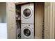 Functional laundry closet with stacked washer and dryer, optimizing space at 707 Highland N St, St Petersburg, FL 33701