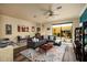 Comfortable living room with a grey sectional sofa, stylish area rug, and sliding doors to the outdoor area at 707 Highland N St, St Petersburg, FL 33701