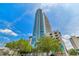 A stunning view of the building's exterior with blue sky and mature trees at 777 N Ashley Dr # 1505, Tampa, FL 33602