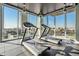 Modern gym with treadmills and floor to ceiling windows overlooking the cityscape at 777 N Ashley Dr # 1505, Tampa, FL 33602