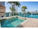 Rooftop hot tub and community pool offer a relaxing retreat with city views and palm trees at 777 N Ashley Dr # 1505, Tampa, FL 33602