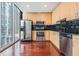 Modern kitchen features stainless appliances, sleek countertops, and a large window with city views at 777 N Ashley Dr # 1505, Tampa, FL 33602