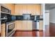 Modern kitchen features stainless appliances, sleek countertops, and hardwood floor at 777 N Ashley Dr # 1505, Tampa, FL 33602