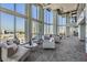 Bright lounge area with floor-to-ceiling windows, comfortable seating, and city views at 777 N Ashley Dr # 1505, Tampa, FL 33602