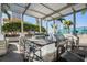 Outdoor kitchen with grill, bar seating, and pergola, perfect for entertaining at 777 N Ashley Dr # 1505, Tampa, FL 33602