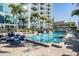 Community pool with plenty of room for lounging in the sun with views of the building at 777 N Ashley Dr # 1505, Tampa, FL 33602