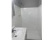 Bathroom featuring an updated vanity and shower at 7908 Rideout Rd, Tampa, FL 33619