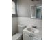 Bathroom featuring a single vanity, tiled walls, and window at 7908 Rideout Rd, Tampa, FL 33619