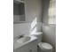 Updated bathroom with new toilet, vanity and bright sunlight at 7908 Rideout Rd, Tampa, FL 33619