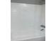 Clean bathtub with white tile surround at 7908 Rideout Rd, Tampa, FL 33619