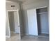 Bedroom features closet and entrance door at 7908 Rideout Rd, Tampa, FL 33619