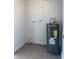 Utility room featuring a new hot water heater at 7908 Rideout Rd, Tampa, FL 33619