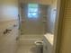 A full bathroom with shower/tub combo and tiled walls at 8969 109Th Ter, Seminole, FL 33777