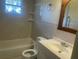 A full bathroom with tub and a window at 8969 109Th Ter, Seminole, FL 33777