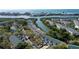 Aerial view showcasing waterfront condos on canal leading to ocean, surrounded by mature trees at 9920 Indian Key Trl # 29, Seminole, FL 33776