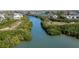 Scenic aerial view of waterfront property with lush mangroves and tranquil canal at 9920 Indian Key Trl # 29, Seminole, FL 33776