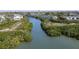 Scenic aerial view of waterfront property with lush mangroves and tranquil canal at 9920 Indian Key Trl # 29, Seminole, FL 33776