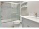 Updated bathroom showcasing a tiled shower with glass door and modern vanity at 9920 Indian Key Trl # 29, Seminole, FL 33776