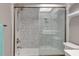 Bathroom featuring a tiled shower with glass door and modern vanity at 9920 Indian Key Trl # 29, Seminole, FL 33776