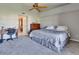 Bedroom featuring neutral decor, carpet, and a desk at 9920 Indian Key Trl # 29, Seminole, FL 33776