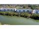 Waterfront condos with private docks sit along the calm waterway surrounded by lush greenery at 9920 Indian Key Trl # 29, Seminole, FL 33776