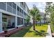 Exterior of condos featuring patios, landscaping, and waterfront access at 9920 Indian Key Trl # 29, Seminole, FL 33776