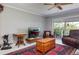 Cozy living room featuring a ceiling fan and access to the outdoor balcony at 9920 Indian Key Trl # 29, Seminole, FL 33776