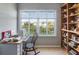 Window view of a tranquil study area, featuring built-in shelving and natural light at 9920 Indian Key Trl # 29, Seminole, FL 33776