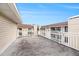 Spacious outdoor patio seating area with railings and views of the complex at 1000 W Horatio St # 327, Tampa, FL 33606