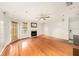 Bright living room featuring hardwood floors and a cozy fireplace at 1000 W Horatio St # 327, Tampa, FL 33606