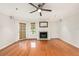 View of the bright living room with hardwood floors and a fireplace at 1000 W Horatio St # 327, Tampa, FL 33606