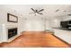 Open living area featuring hardwood floors, fireplace and adjacent to kitchen at 1000 W Horatio St # 327, Tampa, FL 33606